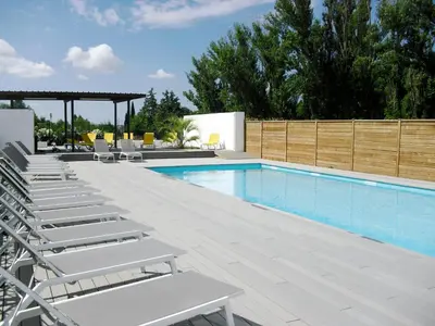a swimming pool with chaise lounge chairs and a swimming pool at Studio à Deux Pas d'Aix in Aix-en-Provence