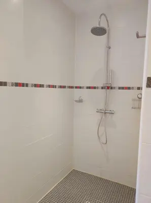 a shower with a glass door in a bathroom at GITE AUX 4 SAISONS DU COLORADO PROVENÇAL - 3 ÉTOILES - Rustrel in Rustrel