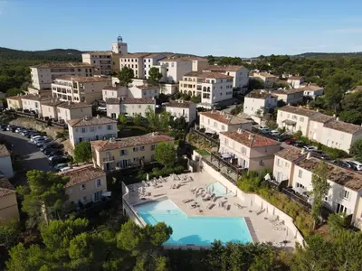 an aerial view of a town with a swimming pool at Maison de Vacances en Provence avec Piscine, Golf à Proximité, Fibre et Linge Haut de Gamme - FR-1-658-9 in Mallemort