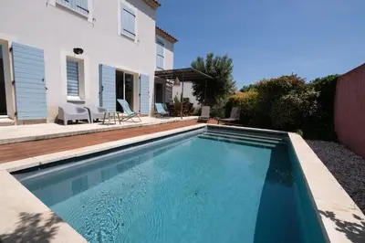 a swimming pool in front of a house at nice house with private pool - 6 persons in the center of the village of mérindol in the luberon in provence in Mérindol