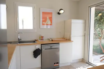 a kitchen with a sink and a dishwasher at nice house with private pool - 6 persons in the center of the village of mérindol in the luberon in provence in Mérindol