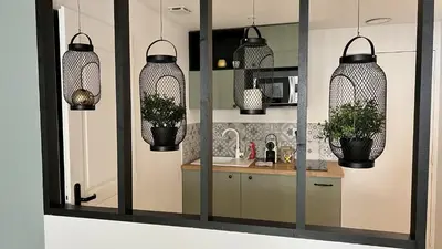 a mirror in a kitchen with potted plants at Le Petit Patio in Aix-en-Provence
