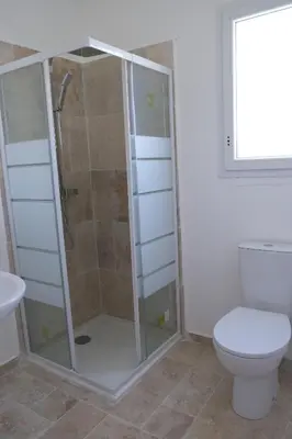 a bathroom with a shower and a toilet at charming villa with heated pool, 14 people, located in aureille, near les baux de provence, in the alpilles in Aureille