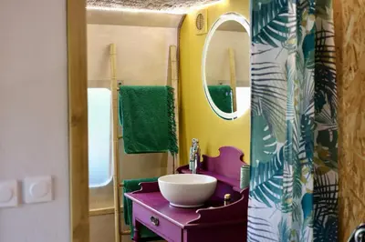 a bathroom with a sink and a mirror at Mas des muses in LʼIsle-sur-la-Sorgue