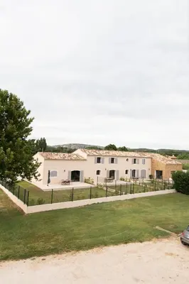 a white house with a fence in front of it at MAISON LAVANDE du MAS LOU CAPY in Salon-de-Provence