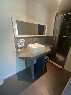 a bathroom with a sink and a mirror at Property with panoramic views in Cabrières-dʼAvignon