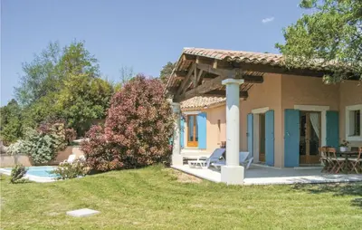 a house with a patio and a yard at Amazing Home In Roussillon With Wifi in Roussillon