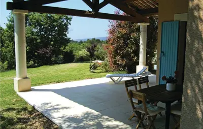 a patio with a table and a bench on it at Amazing Home In Roussillon With Wifi in Roussillon