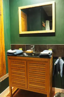 a bathroom with a sink and a mirror at Chambres d'Hôtes Le relais des marmottes en Luberon in Lagnes