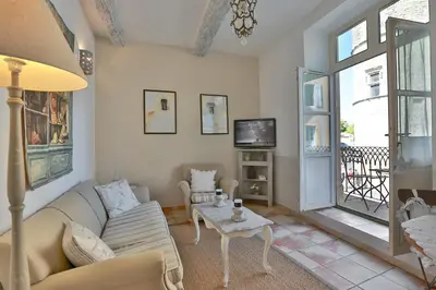 a living room with a couch and a table at Apartments - Experience of PROVENCE in Gordes