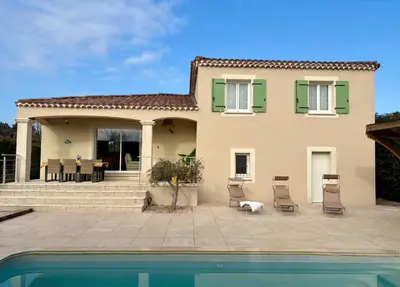 a house with a swimming pool in front of it at Proche Saint Rémy de Provence in Mollégès