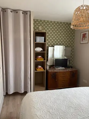 a bedroom with a bed and a desk with a computer at Proche Saint Rémy de Provence in Mollégès