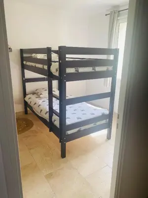 a room with two bunk beds in a room at La Maison d à côté 8 à 10 personnes in Carpentras