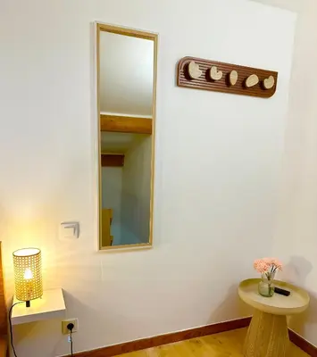 a room with a mirror and a table and a mirror at Maisonnette avec terrasse privée au calme absolu - proche LOURMARIN in Cadenet
