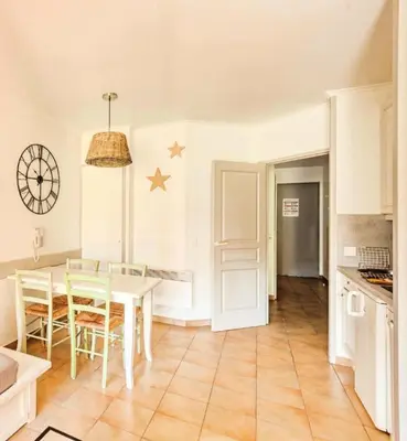 a kitchen and dining room with a table and chairs at Village Pont Royal en Provence - maeva Home - Studio 4 personnes - Sélection MAE-2934 in Mallemort