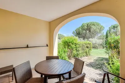 a dining room with a table and chairs and a window at Village Pont Royal en Provence - maeva Home - Studio 4 personnes - Sélection MAE-2934 in Mallemort