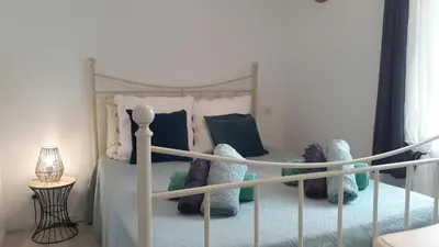 a bedroom with a bed with stuffed animals on it at OUSTAOU DU GAYET gîte de charme avec piscine privée in Lourmarin