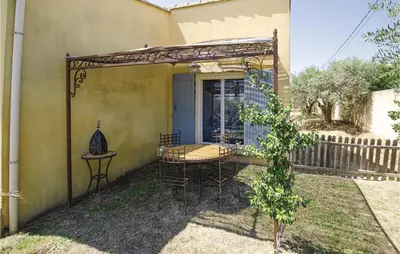 a pergola on the side of a house at Amazing Home In Caumont Sur Durance in Caumont-sur-Durance