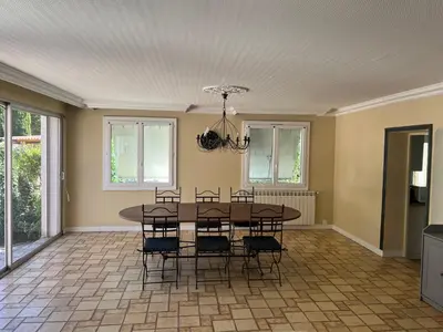 a dining room with a table and chairs at Maison Provençale avec piscine in Carpentras