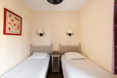 two beds in a small room with white walls at Les Coteaux de Pont Royal en Provence - maeva Home - Maison 3 Pièces 6 Personnes - Sélection MAE-8177 in Mallemort