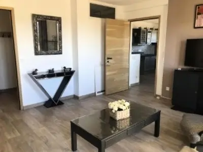 a living room with a table and a sink at Les Coteaux de Pont Royal en Provence - maeva Home - Appartement 4 pièces 7 personnes - Prestige - super Home MAE-2094 in Mallemort