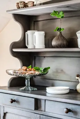 a table with a plate of food on a shelf at Le Clos d'Estellan - Piscine chauffée in Bonnieux