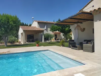 a swimming pool in the backyard of a house at Lou Mazet provençal à Eygalières - Piscine privée in Eygalières