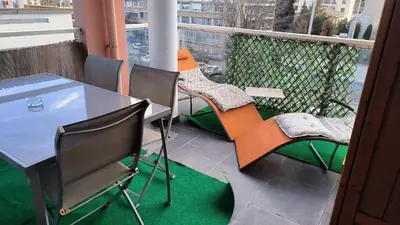 a balcony with a table and chairs on a balcony at Appartement Port Royal in Aix-en-Provence