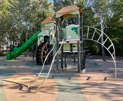 a playground with a slide in a park at Au NÈGO CHIN 105m2 en bord de Sorgue in LʼIsle-sur-la-Sorgue