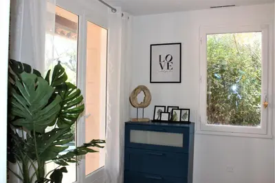 a room with a blue dresser and a window at Calme et Intimité proche Avignon Piscine options au choix privée ou partagée de juin à octobre in Morières-lès-Avignon