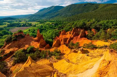 an aerial view of a mountain with trees and rocks at Les Moineaux in Rustrel