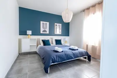 a blue bedroom with a bed with blue walls at ☆ Blue Provençal Appartement ☆ in Morières-lès-Avignon