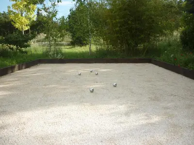 a bunch of balls sitting on top of a concrete patio at Chalet de Provence in Aix-en-Provence
