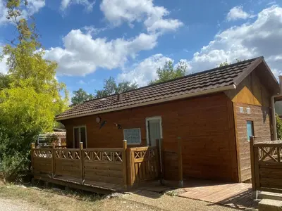 a small wooden building with a wooden fence at Chalet de Provence in Aix-en-Provence