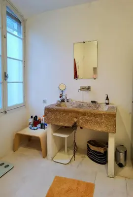 a bathroom with a sink and a mirror at Romantic Provencal house with terrace in Saignon