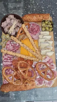a tray of food with cheese and meats and bread at L'Aurore Love Room de prestige jacuzzi sauna piscine chauffée cuisine in Carpentras