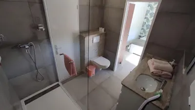 a bathroom with a shower and a sink and a toilet at La maison de Marie Hélène 2 piscine partagée in Aix-en-Provence