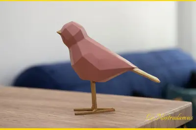 a wooden bird figurine on a table at Le Nostradamus - Magnifique appartement cours principal plein centre avec parking in Salon-de-Provence