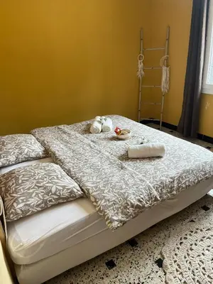 a bed with two stuffed animals sitting on it at Gîte de la bastide in Monteux