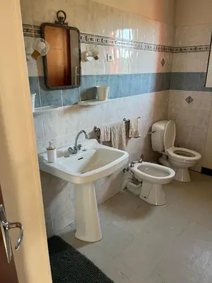 a bathroom with a sink and a toilet at Gîte de la bastide in Monteux