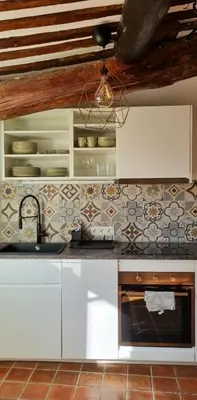 a kitchen with a sink and a counter top at Les toits de Mignet in Aix-en-Provence