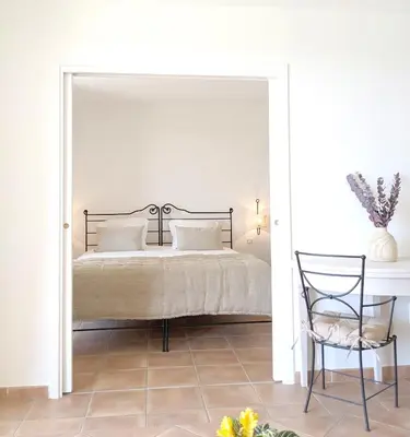 a living room with a couch and a table at ALLURA GOLF APPARTEMENT in Saumane-de-Vaucluse
