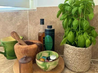 a counter with a bowl of cosmetics and a plant at Mas Notre Dame in Eygalières