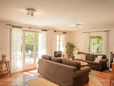 a living room with a couch and a table at Villa Martinet in Carpentras