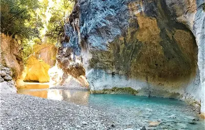 a cave with a pool of water in a canyon at 3 Bedroom Amazing Home In Montfavet in Montfavet