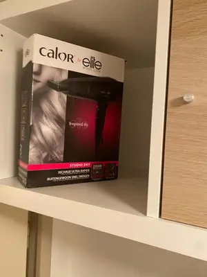 a book sitting on top of a shelf at Maison de vacances au calme 4 personnes residence avec piscine in Aubignan