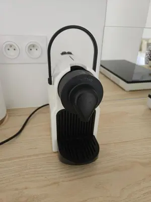 a black and white object sitting on a wooden floor at Havre de paix climatisé vers Gordes - Spa & nature in Beaumettes