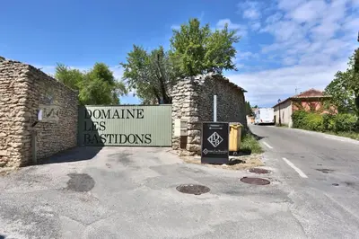 a sign for a house on the side of a road at Le Bastidon de Guillemette in Gordes