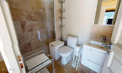 a bathroom with a toilet and a shower and a sink at Sérénité en Provence, Climatisée in La Roque-sur-Pernes
