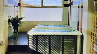 a room with a bath tub in a room with a window at maison village vacances demeures du Ventoux in Aubignan